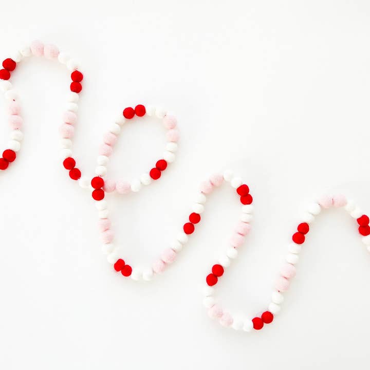 Red & Pink Mini Felt Ball Garland for wholesale by Pearl & Jane