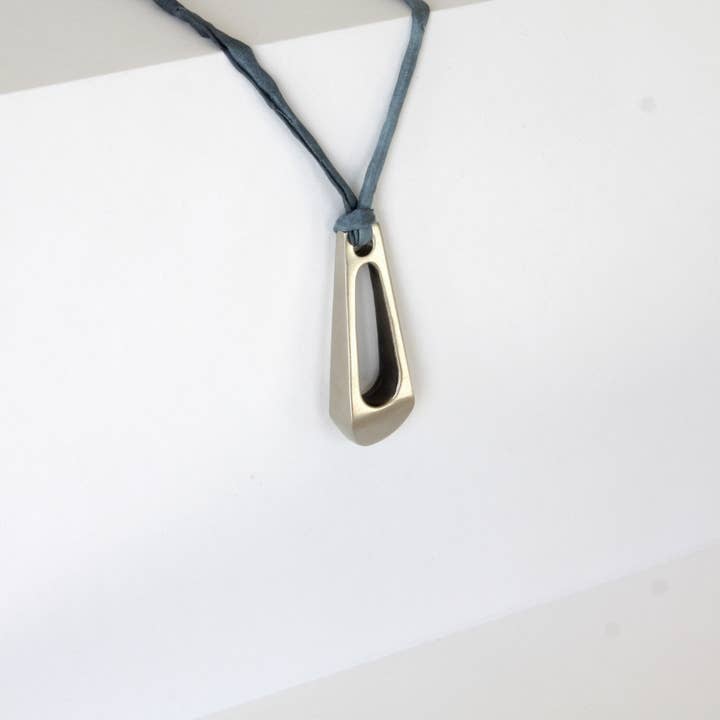 Kostenki Necklace - Yellow Brass or White Brass on Silk Cord for wholesale by Powers Handcrafted Jewelry