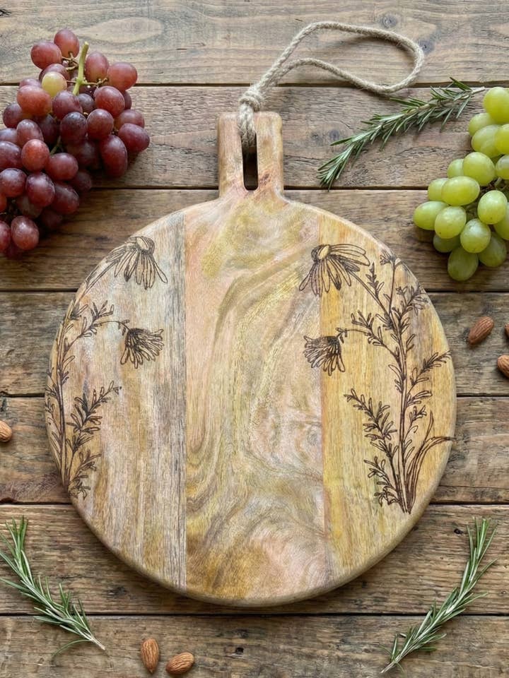 11" Floral Laser Engraved Round Mango Wood Cutting Board for wholesale by House of Wren