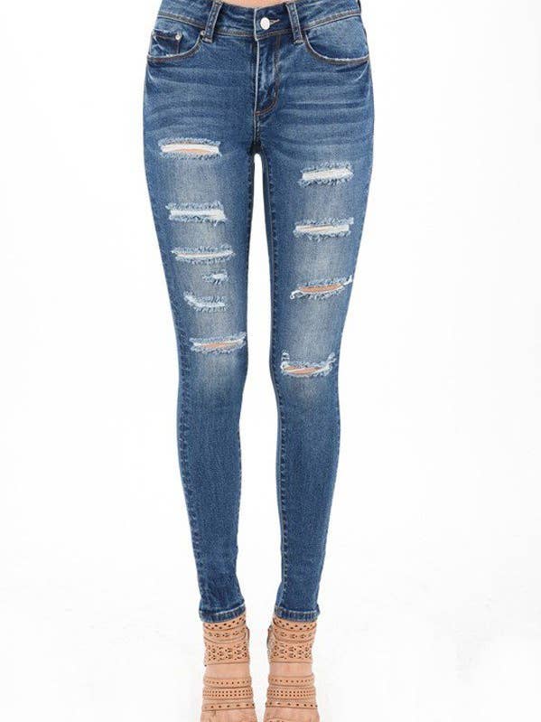 Jeans skinny blu scuro a vita bassa con effetto invecchiato per la vendita all'ingrosso da parte di The Steven Wick Company