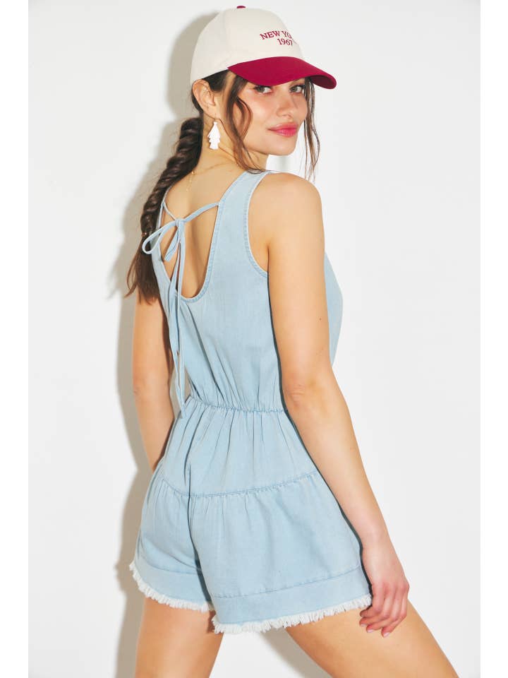 WASHED DENIM ROMPER WITH DISTRESSED DETAILING for wholesale on Faire
