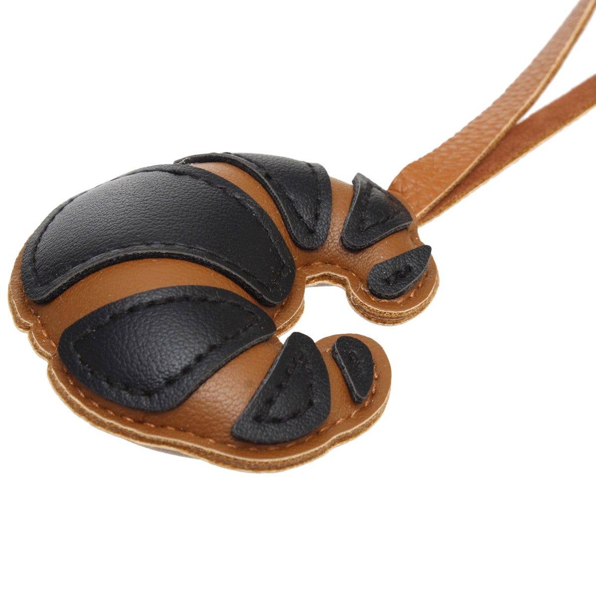Färg: Black Väskcharm Svart Läder Croissant Väskaccessoar för wholesale på Faire1