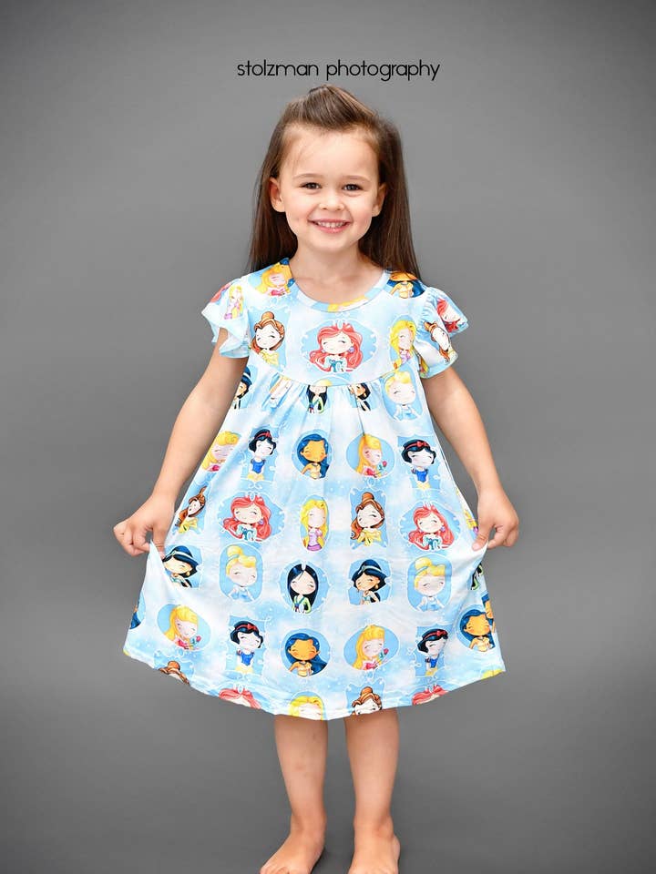Blue Happy Princess Milk Silk Flutter Dress for wholesale by Great Lakes Kids Apparel