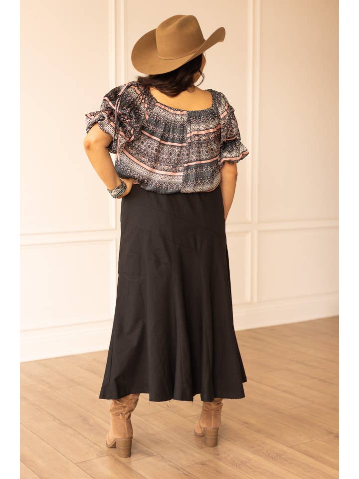 The Stella Black Linen Versi Dress for wholesale on Faire