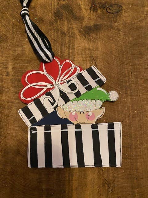 Elf in gift Christmas Ornament for wholesale by Pink Fish Studios, LLC.