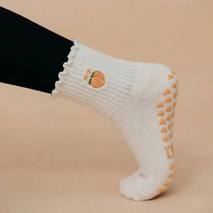 Orange Embroidered "Nice Peach" Ruffled Pilates Grip Socks for wholesale by Almla Active