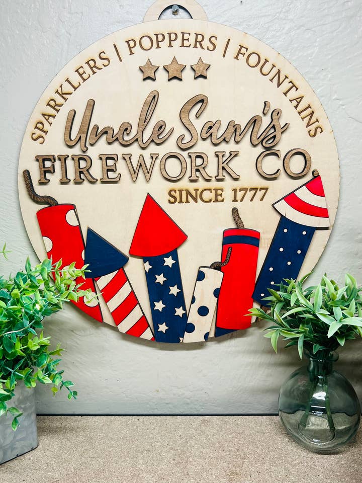 “Uncle Sam’s Firework” Door Hanger (14” Round) for wholesale by Mimi and Me Boutique