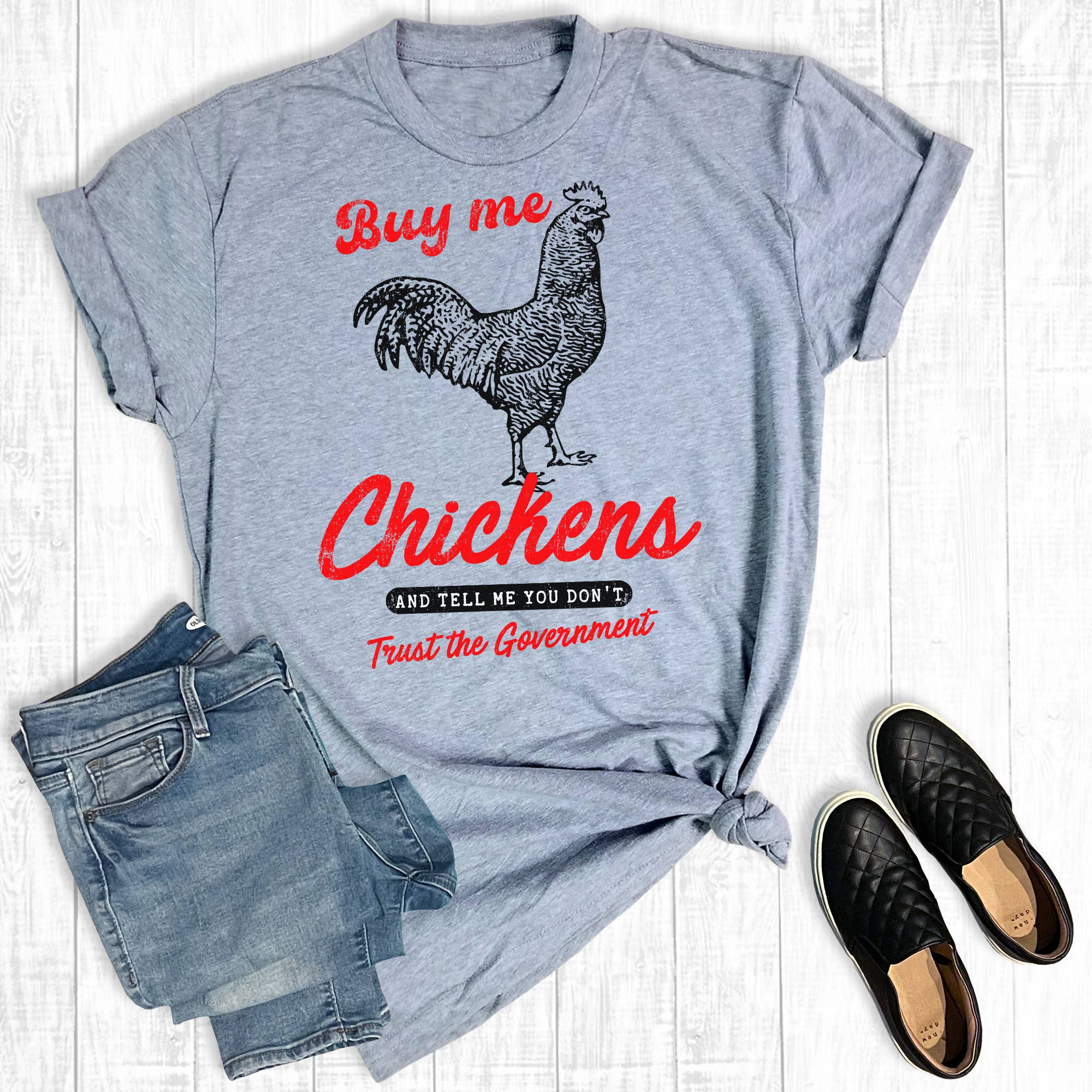 Gray Western Funny Buy Me Chickens Graphic Tee for wholesale on Faire