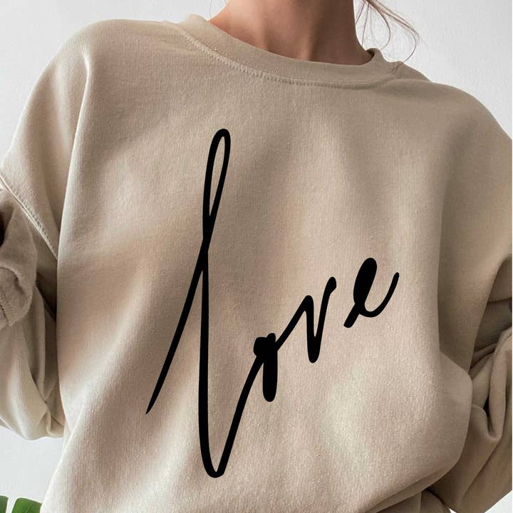 Sweatshirt graphique LOVE pour la vente par BLUME & CO.