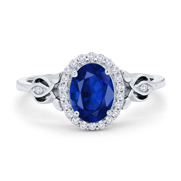 Oval Halo simuleret blå safir CZ forlovelsesring for engroshandel hos Blue Apple Imports