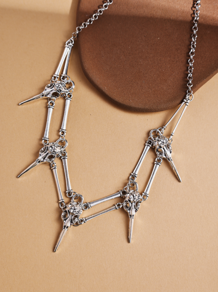 Revelari – wholesale Pendant/charm necklace – Silver Skull and Bone Statement Necklace0