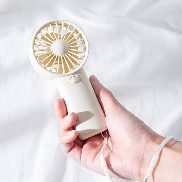 Portable Mini Handheld Fan - Lightweight & Battery Operated and other Purchase Wholesale mini handheld fan. Free Returns & Net 60 Terms on Faire trending on Faire.