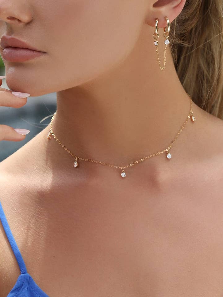 Aros de doble piercing con circonita cúbica, oro amarillo de 14 k para venta al por mayor de The Littl