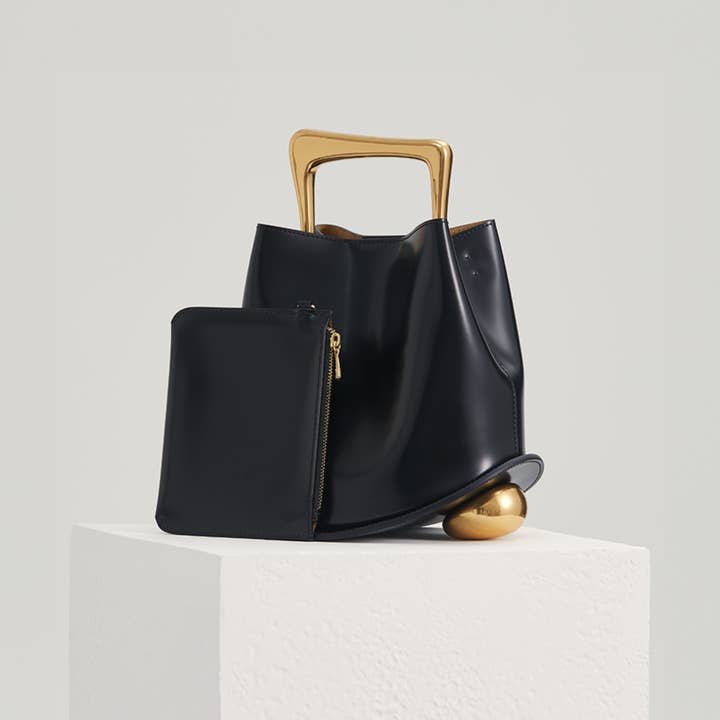 Ozzy Bag - Black & Gold for wholesale on Faire