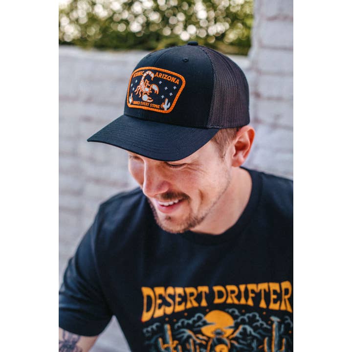 Under Every Stone Curved Trucker - Black for wholesale by Iconic Arizona