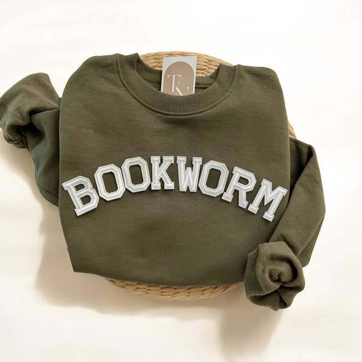 BOOKWORM Sweatshirt, Bookish Merch for wholesale by Threads And Needles, INC.