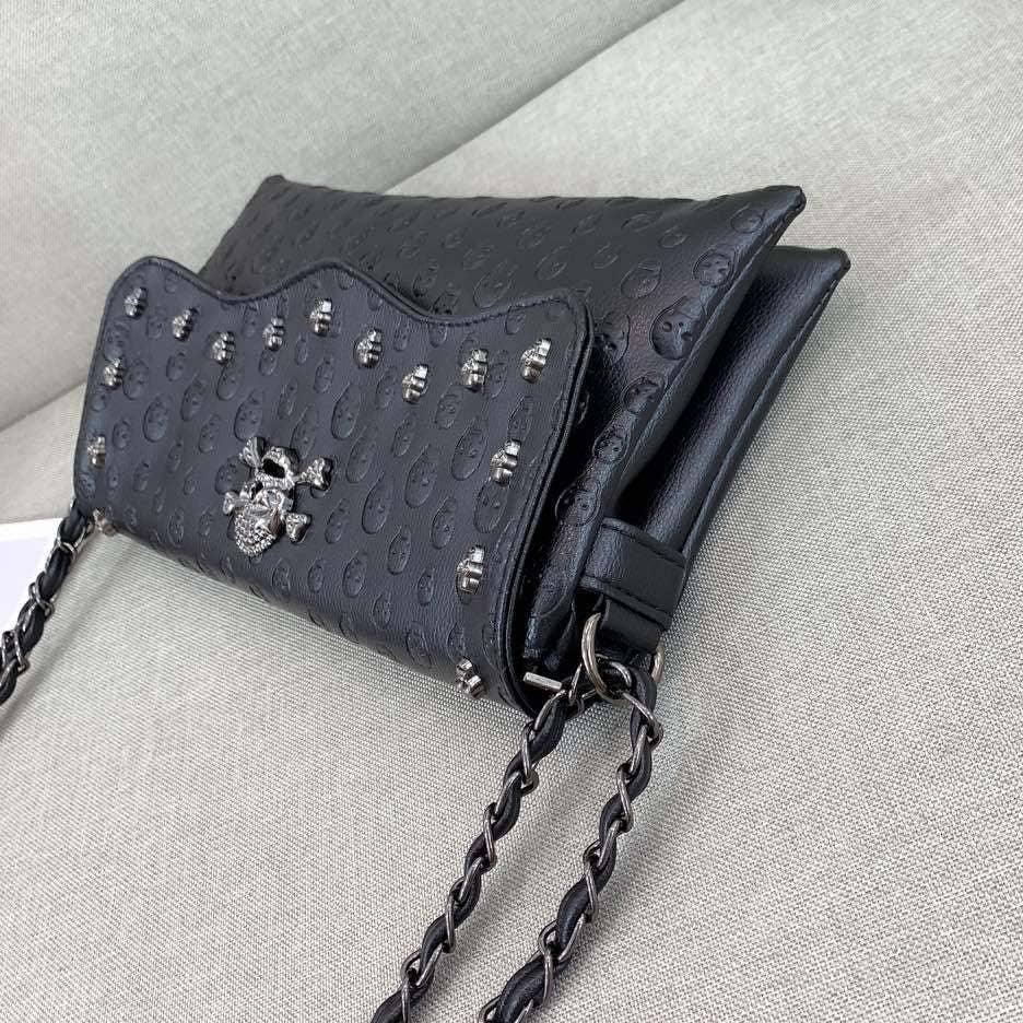 Black Embossed Riveted Skulls Shoulder Bag for wholesale on Faire2