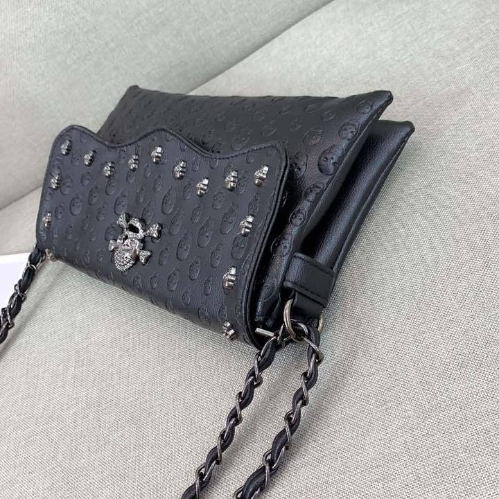 Black Embossed Riveted Skulls Shoulder Bag for wholesale on Faire2