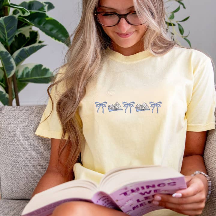 Embroidered Bow-Book Icon Shirt, Sweatshirt, and Hoodie for wholesale by Arden & Gold