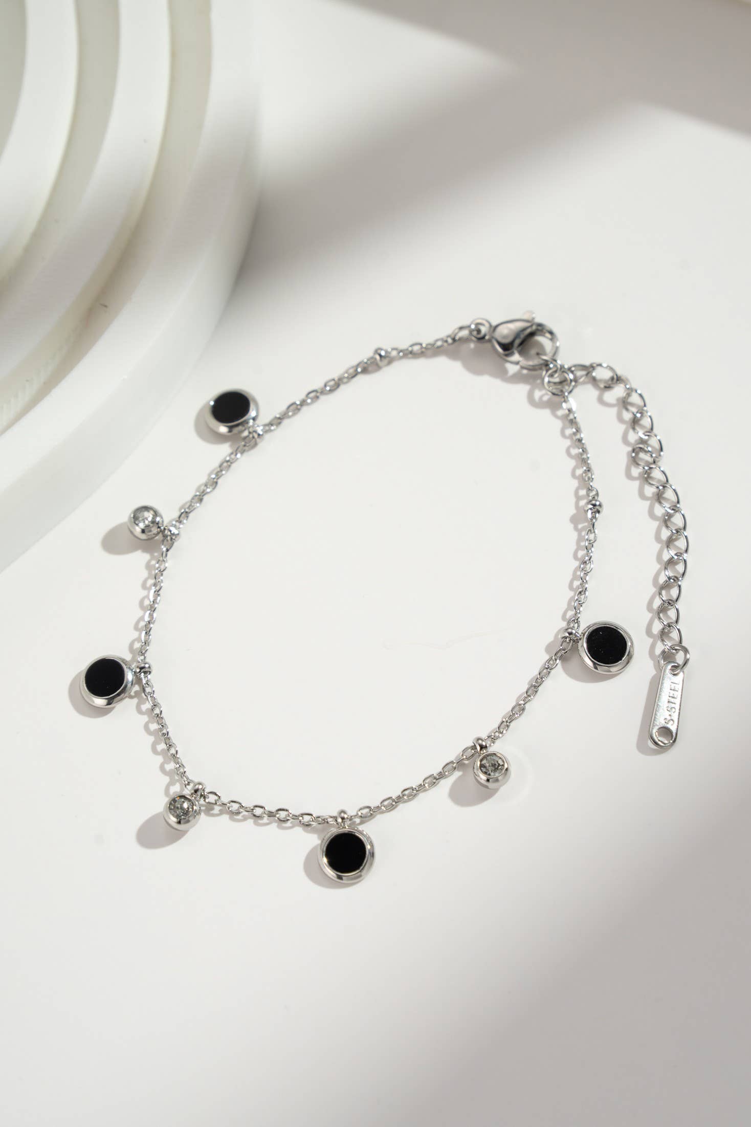 COSMOS – wholesale Charm/dangle bracelet – Black and gold charm bracelet in stainless steel0