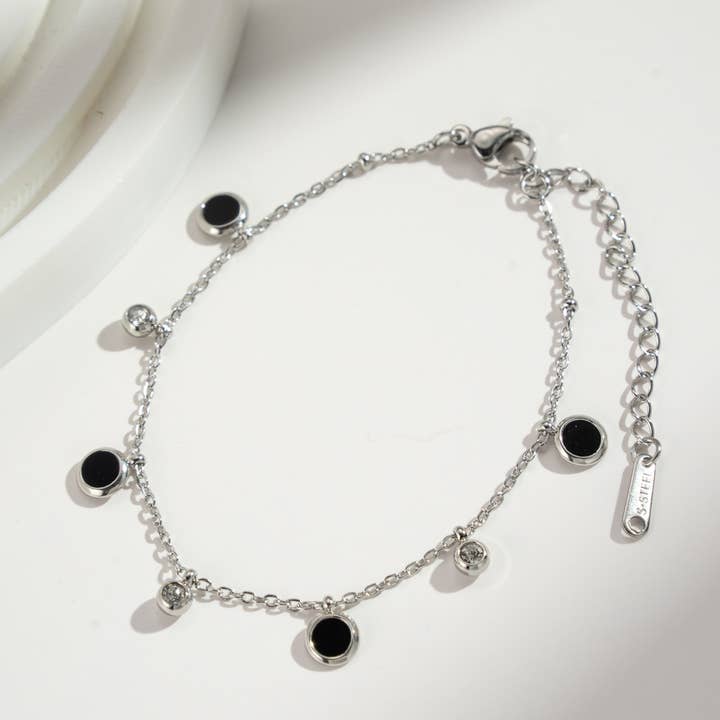 COSMOS – wholesale Charm/dangle bracelet – Black and gold charm bracelet in stainless steel