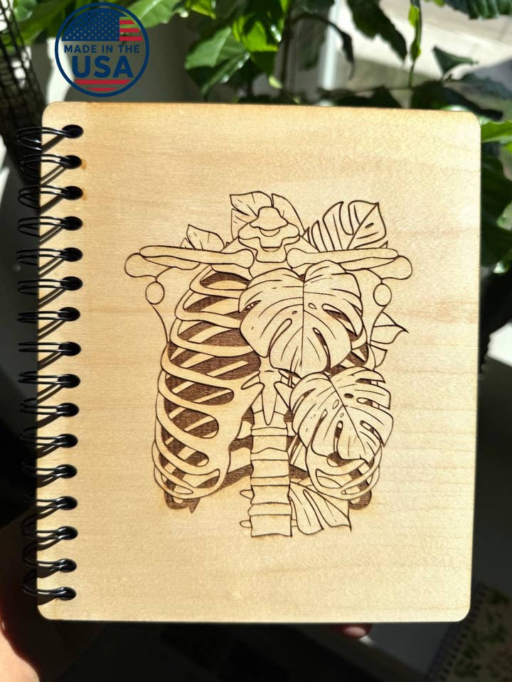 Engraved Wooden Notebook, monsters leaves, skeleton rib cage for wholesale by From Within