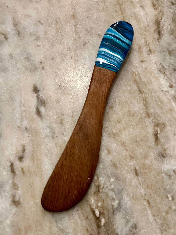 Butter spreader in acacia wood for wholesale by Nikita Fine Art LLC