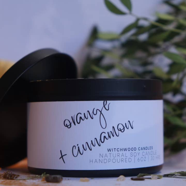 Cinnamon and Orange scented soy candle in matte black tin for wholesale by Witchwood Candles