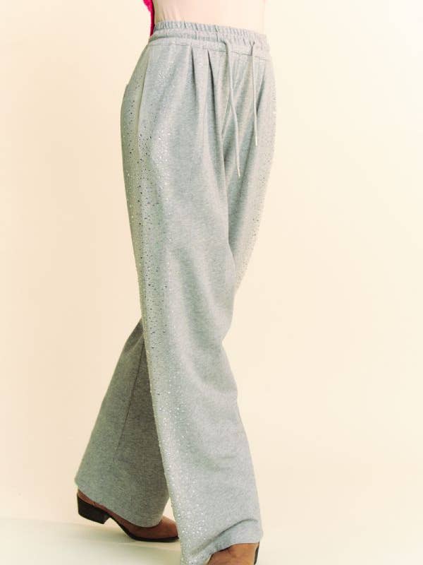 Grigio PANTALONI LUNGHI IN FELPA CON ELASTICO IN VITA CON STRASS in vendita all'ingrosso su Faire