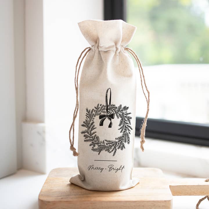 Merry + Bright Wreath Wine Bag for wholesale by Porter Lane Home