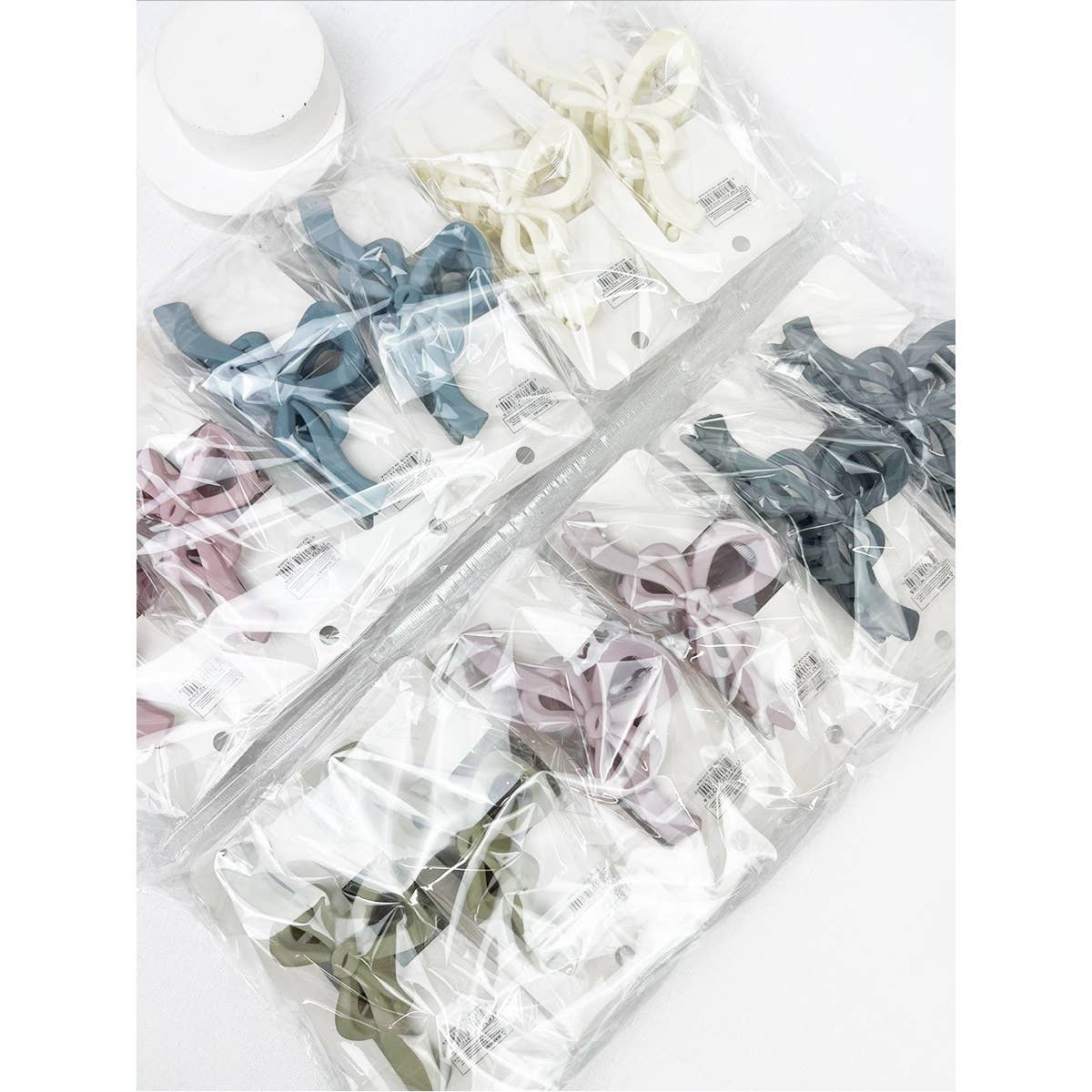 MIX COLOR Knotted Bow Soft Tone Matte Hair Claw for wholesale on Faire8
