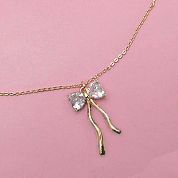 Gold PETITE RHINESTONE BOW NECKLACE | 80N600 for wholesale on Faire
