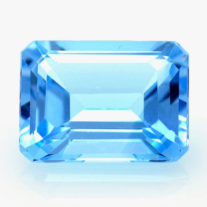 Topazio blu taglio smeraldo 13.89 ct per la vendita all'ingrosso da parte di Naturjoya