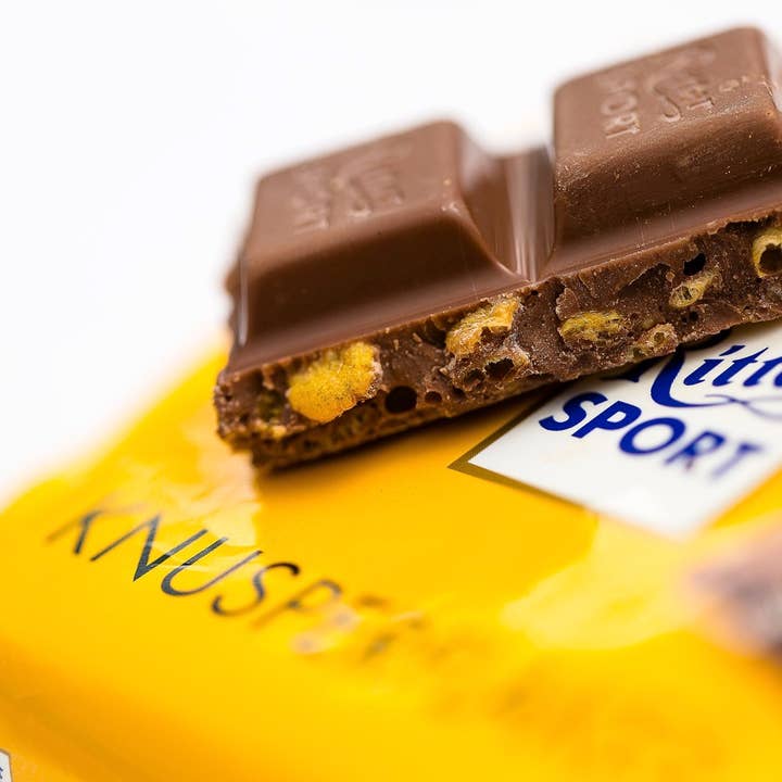 Phoenix Distributions - Venta al por mayor Chocolate - RITTER SPORT Knusperflakes, 100 gramos, 10 unidades1