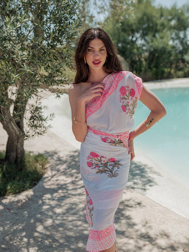 PAREO NEON ORANJE BLOEMEN voor wholesale door Piti Cuiti