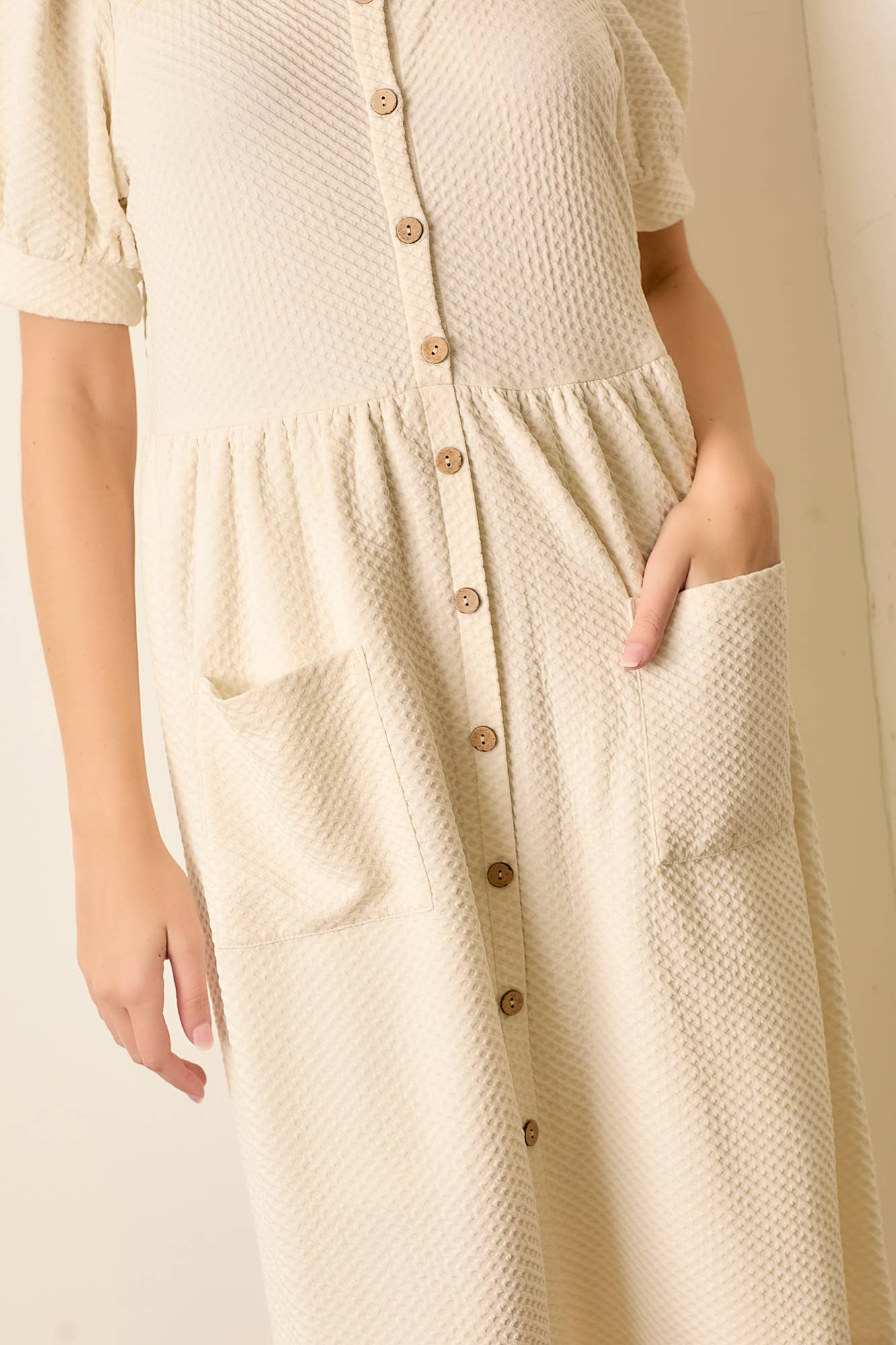 CREAM ROUND NECK BUTTON UP DRESS W POCKET for wholesale on Faire2