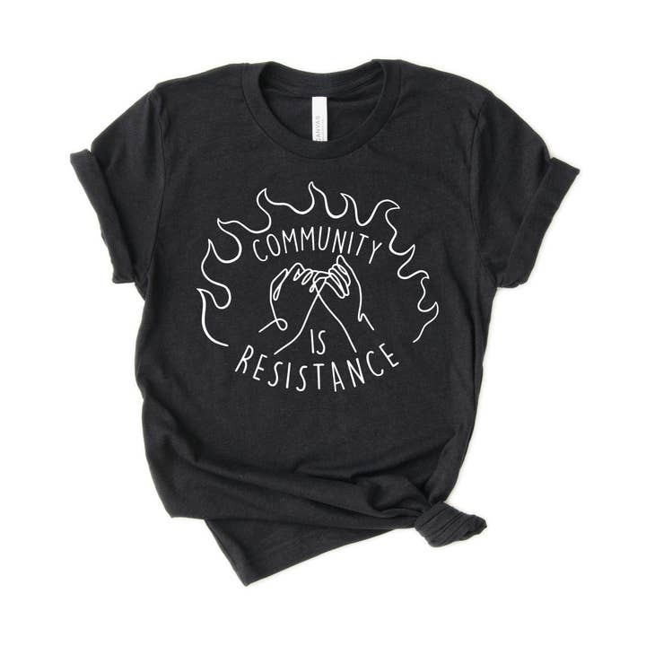 T-shirt unisexe Community is Resistance pour adulte pour la vente par Naked Mangoes