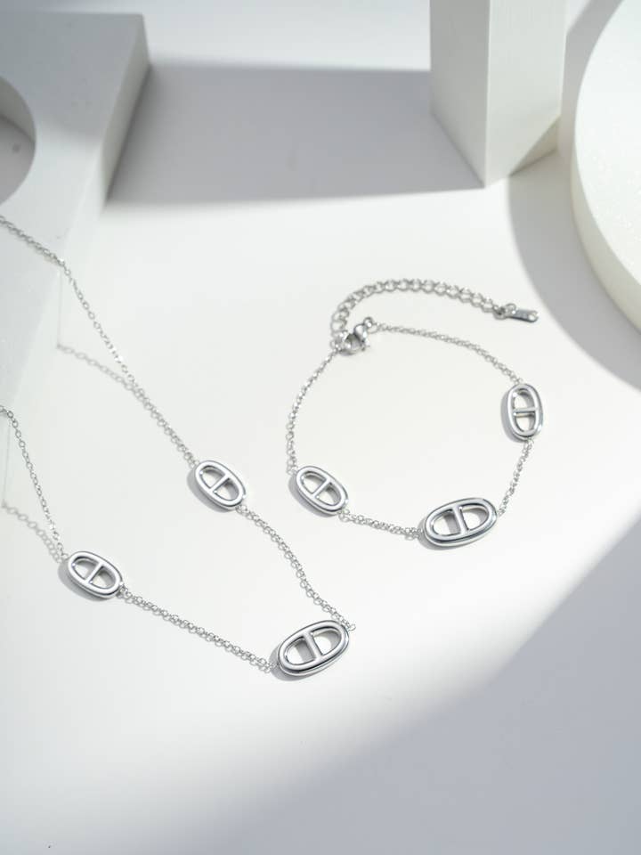 "Stylized Links" set graphic necklace and bracelet for wholesale by COSMOS