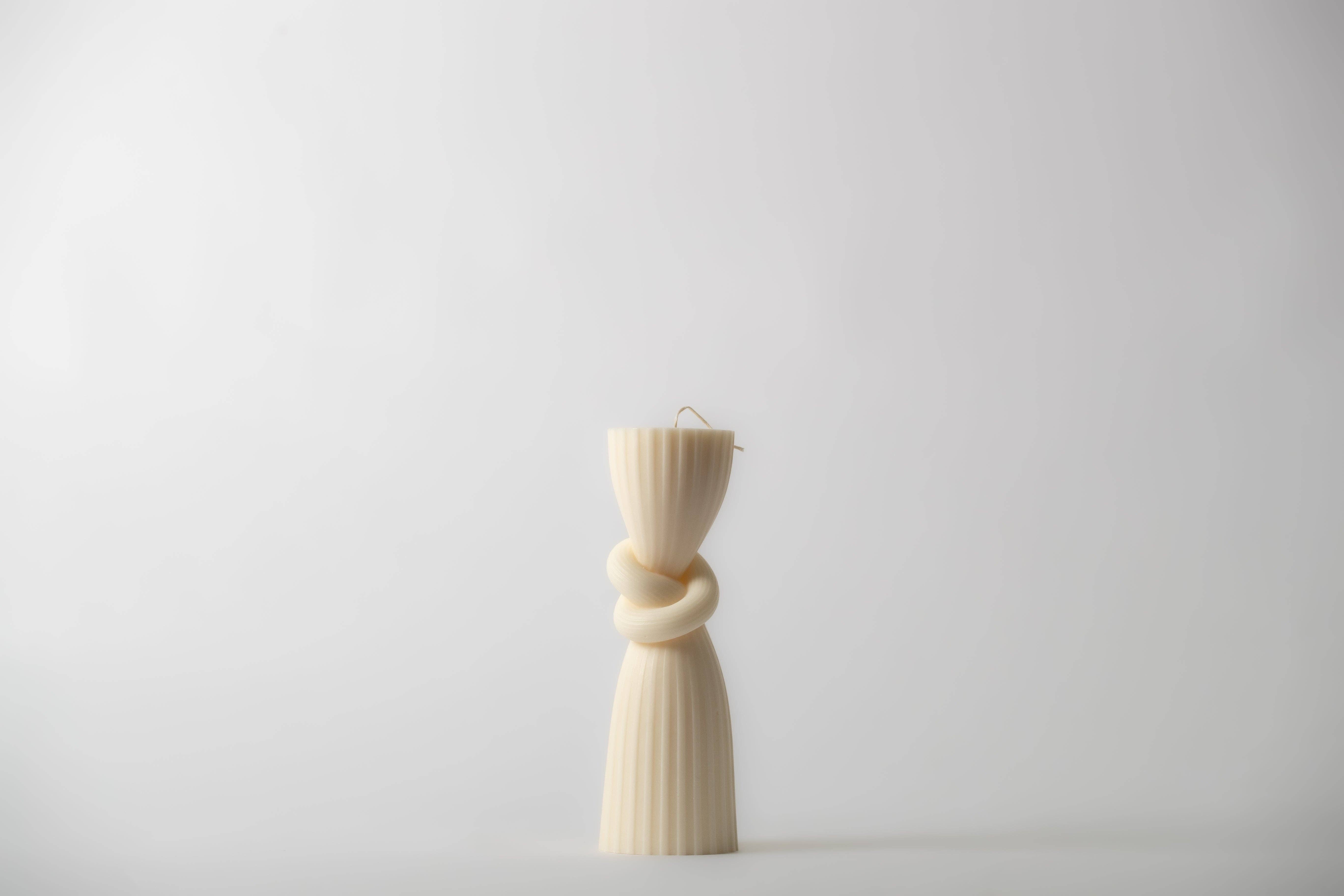 Natural Wax FRANCESCA - Pillar Candle with Knot Design for wholesale on Faire