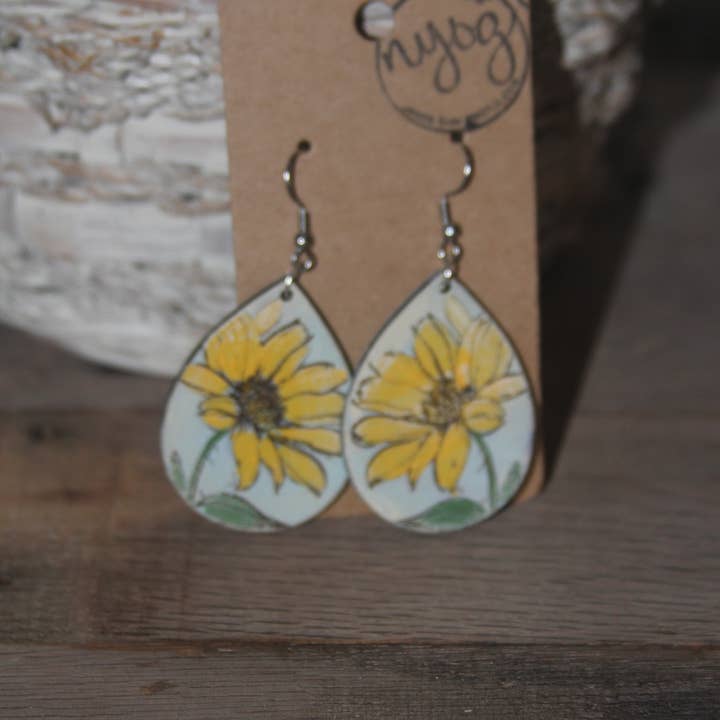 Hermosos pendientes colgantes de girasol con fondo azul para venta al por mayor de NYOG Side Hustle