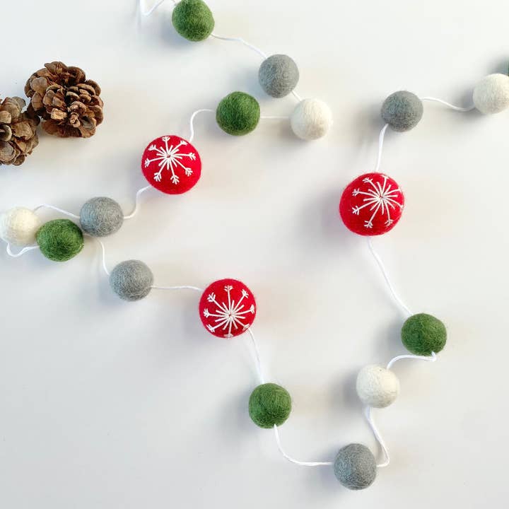 Red Snowflake Ball Garland for wholesale by Wool Jamboree