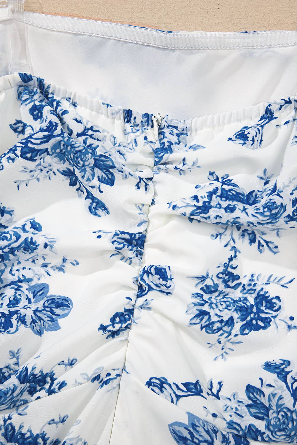 Blue Floral Print Strapless Zipped Back Knot Waist Ruffled Romper for wholesale on Faire9