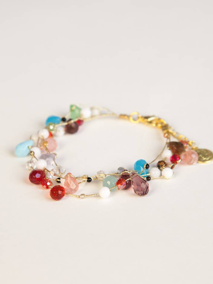 Bracelet en fil de soie multicolore fabriqué à la main pour la vente par Crossroads Accessories Inc