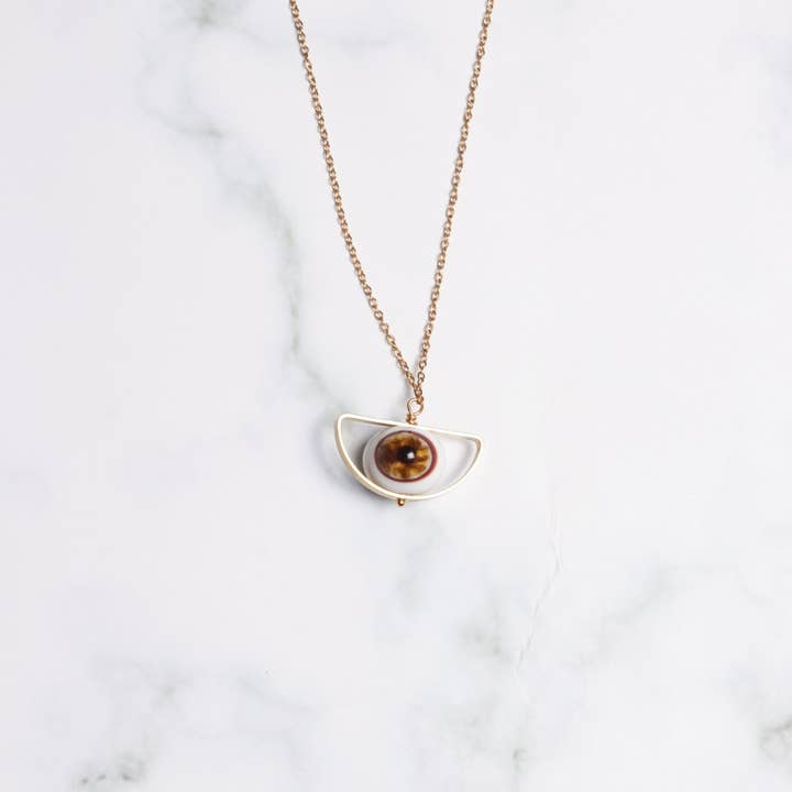 Golden Eye Pendant Necklace for wholesale by Sunset Yogurt