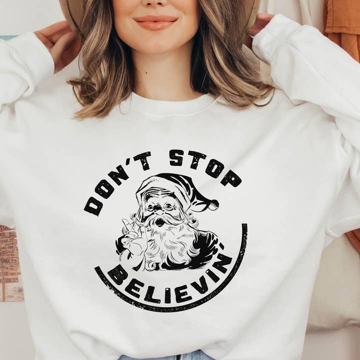 Christmas Sweatshirts Don't Stop Believing Santa Crewneck for wholesale by P E T I T R U E