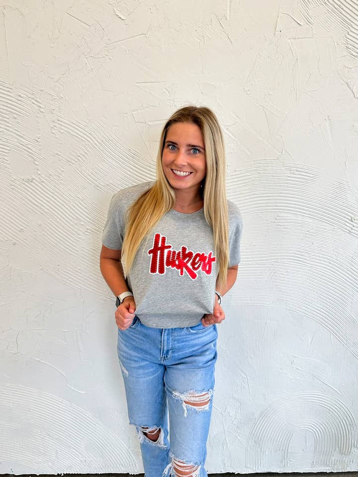 RED METALLIC/ WHITE HUSKERS SCRIPT - LIGHT GREY CROP TEE for wholesale by h.flynn