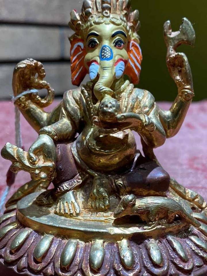 Ganesh vergulde koperThanka-verf gezichtsbeeld (S) voor wholesale door Katmandu Trading Co.