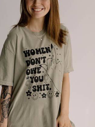 Women Don't Owe You Sh*t Feminist Comfort Colors Graphic Tee for wholesale by Uncommon Wild