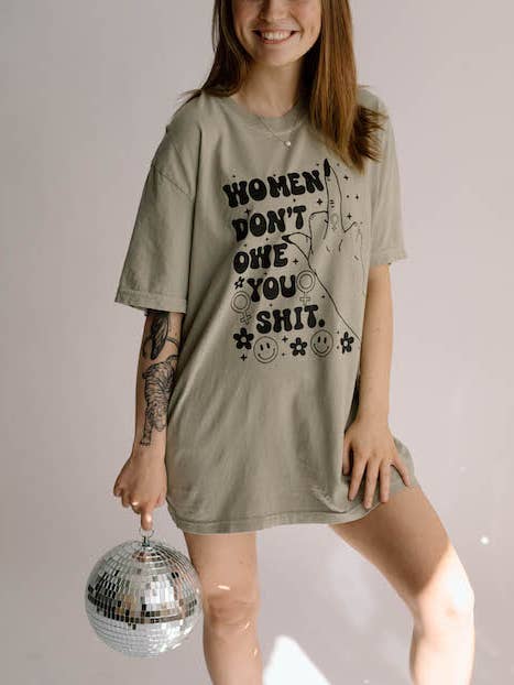 Women Don't Owe You Sh*t Feminist Comfort Colors Graphic Tee for wholesale by Uncommon Wild