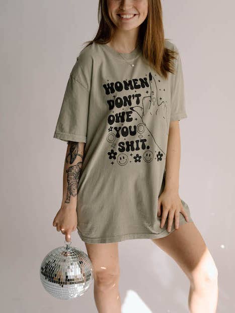 Women Don't Owe You Sh*t Feminist Comfort Colors Graphic Tee for wholesale by Uncommon Wild
